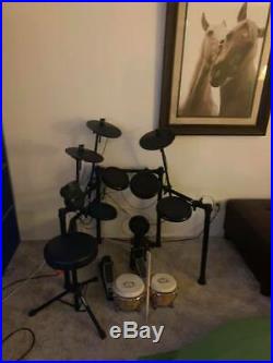 Alesis Electric drum set with chair and drum sticks