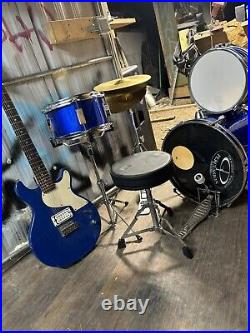 Drum set with electric guitar used